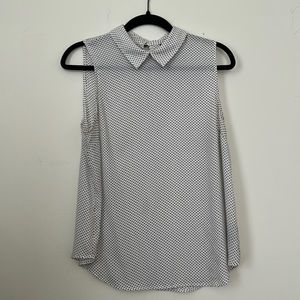 Sheer sleeveless black polka dot blouse with brass buttons